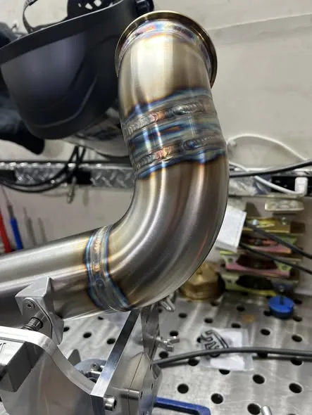 Custom welded titanium exhaust fabrication on the bench