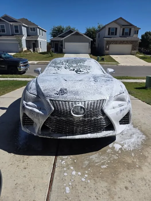 Lexus front end being foam washed at a Central Texas home