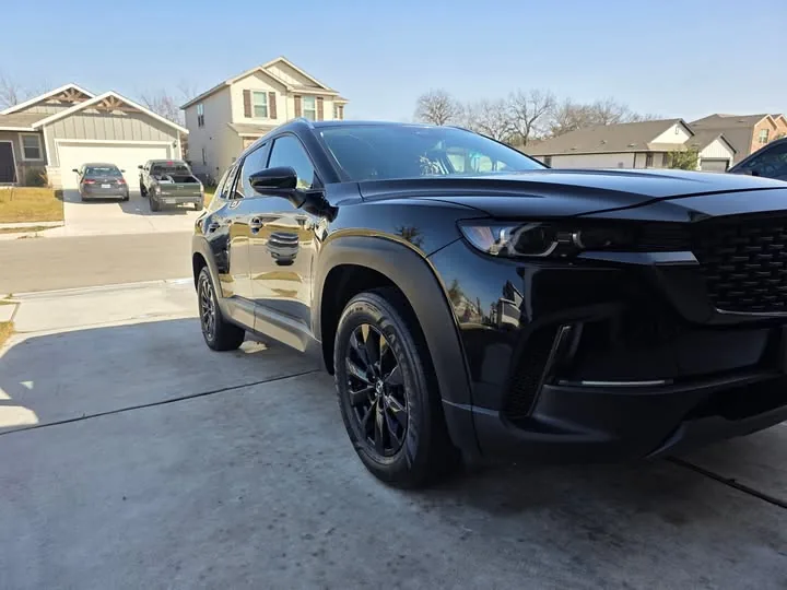 Black Mazda CX-50 front three-quarter after exterior detail