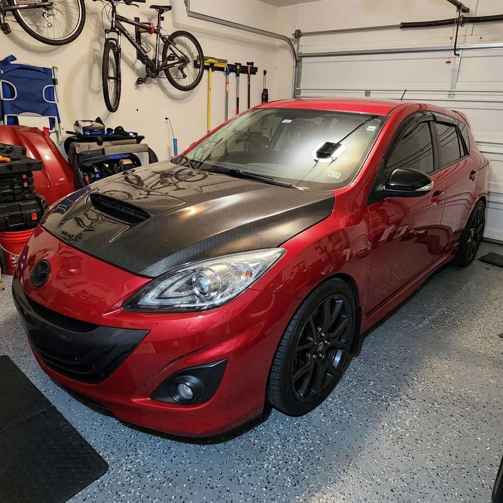 Red Mazdaspeed 3 with carbon hood after a full detail