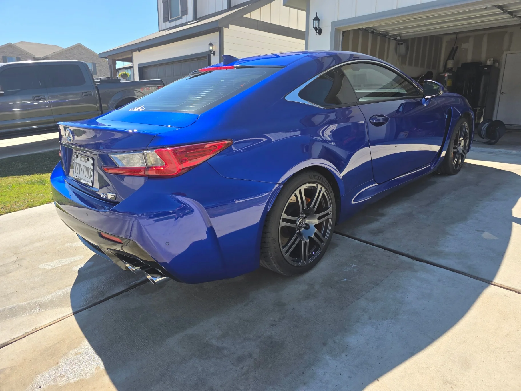 Blue Lexus RC F rear profile gleaming after paint correction and polish